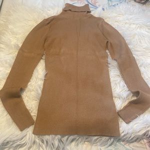 Tan ribbed turtleneck sweatshirt. Great for work or any occasion.